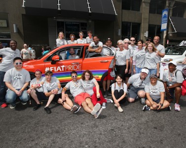 FCA US employee resource group, the Gay and Lesbian Alliance (GALA),  gather around a specially wrapped Fiat 500X at the Motor City Pride parade on June 7, in Detroit